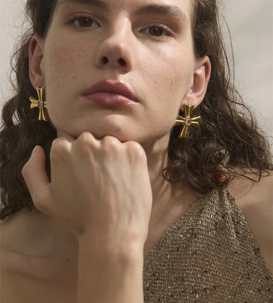 Casting cross statement rust resistant stud earrings - product image