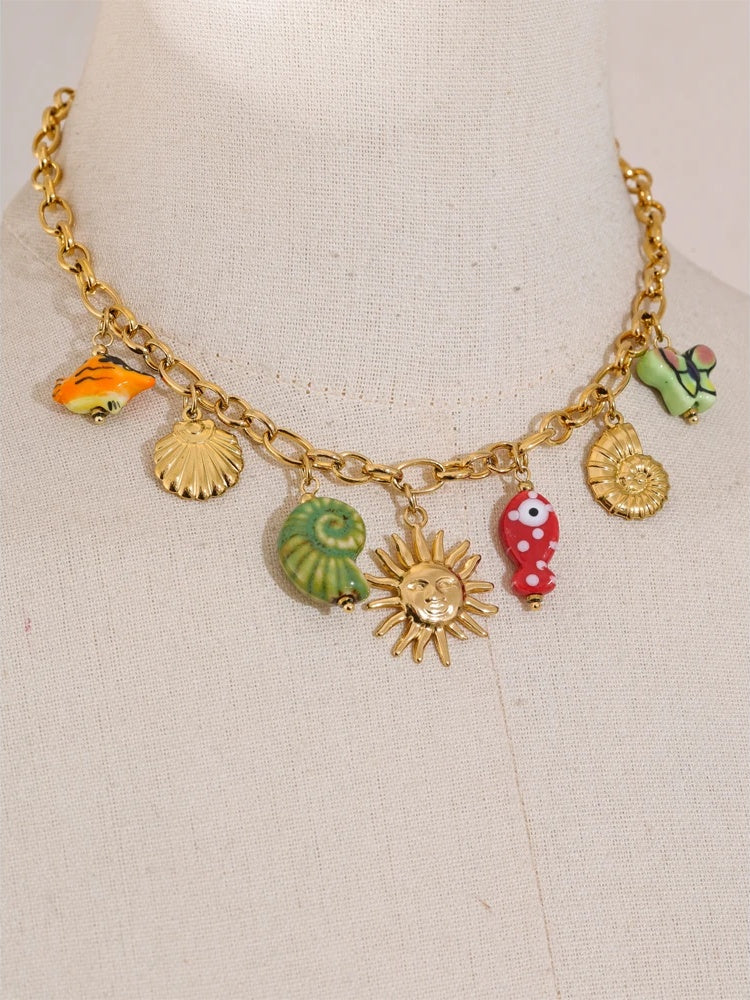 Ceramic conch fish butterfly pendant necklace - product image