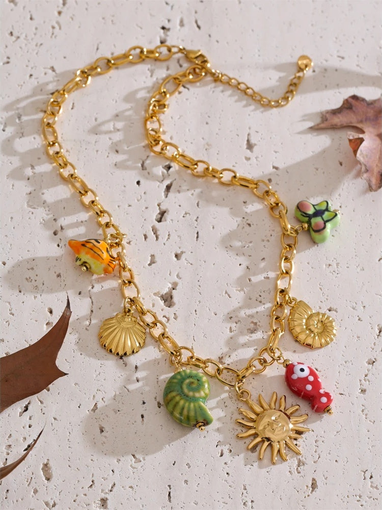 Ceramic conch fish butterfly pendant necklace - product image