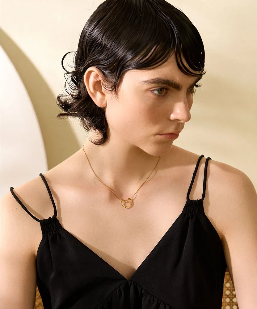 Golden stainless steel heart hollow pendant necklace - product image