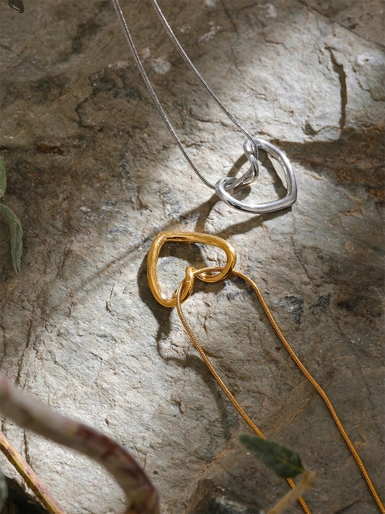 Golden stainless steel heart hollow pendant necklace - product image
