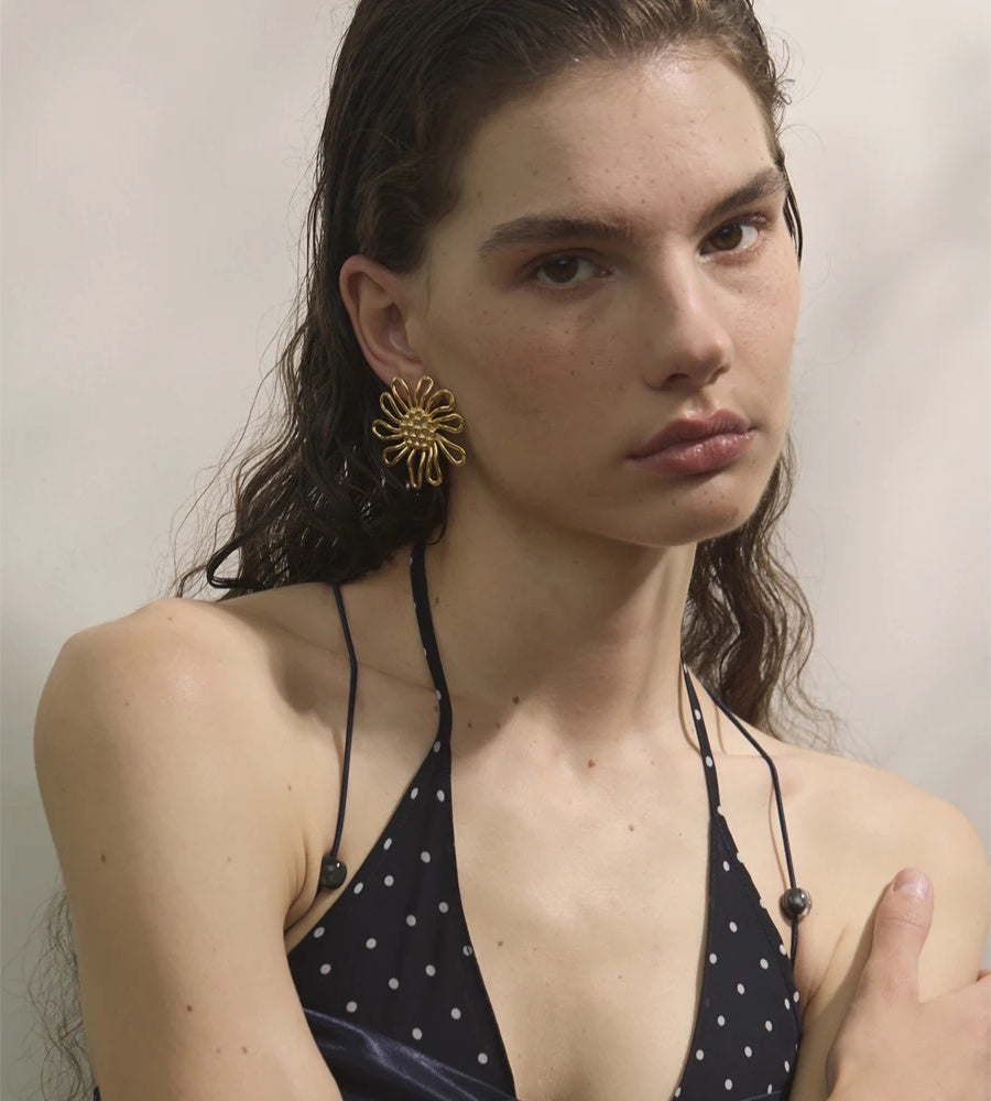 Metal flower golden stud earrings - product image