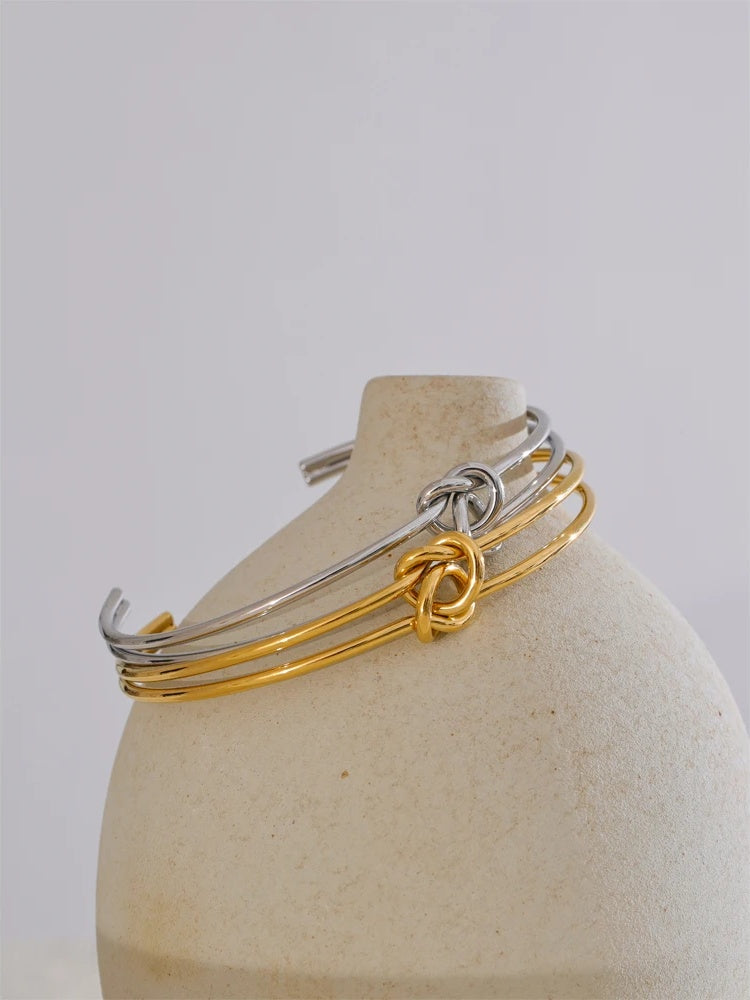 Metal knot open cuff water resistant bracelet - product image
