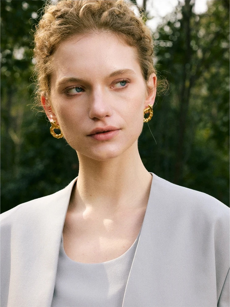 Metal round hollow modern stud earrings - product image