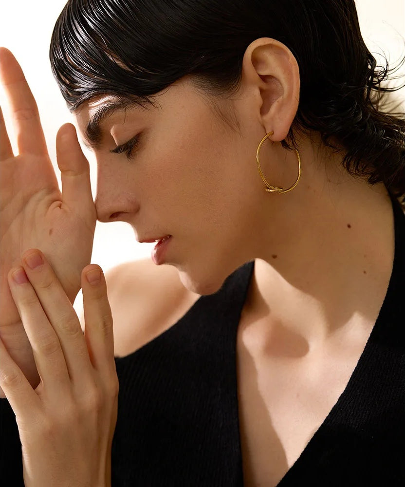 Minimalist knot huggie hoop earrings women - product image
