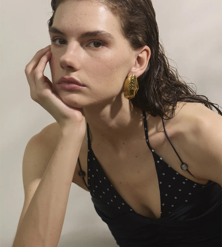 Statement gold color big stud earrings - product image