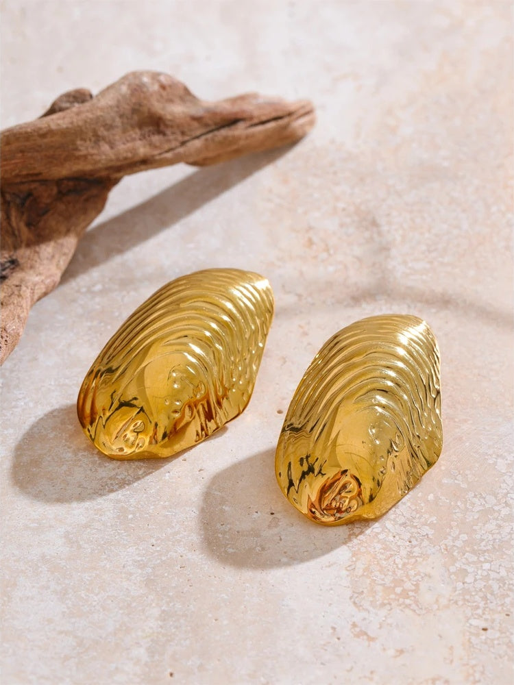 Statement gold color big stud earrings - product image