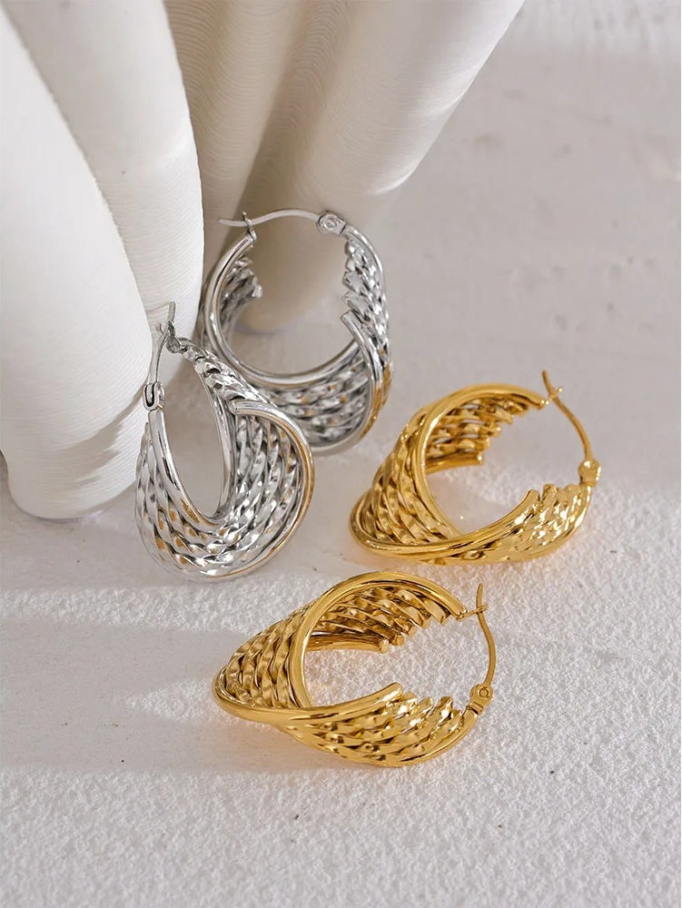 Twisted hollow hoop contemporary statement earrings - product image