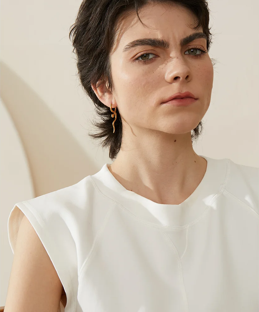 Unique snake textured hoop statement earrings - product image