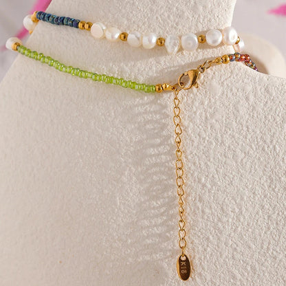 Set of beaded bracelets on a white stand with a floral background