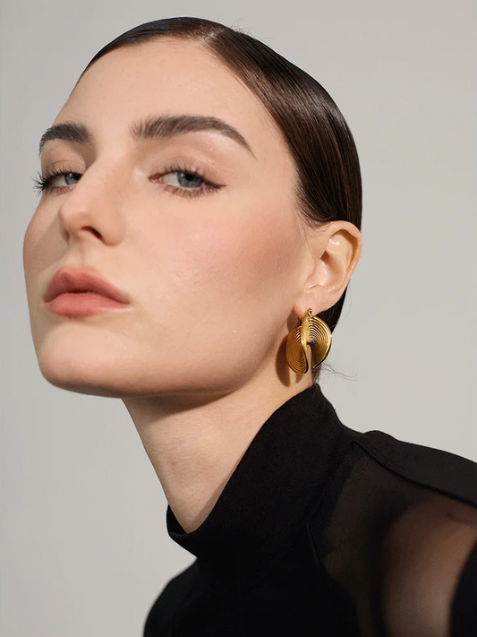 Abstract gold tone metal statement hoop earrings - product image