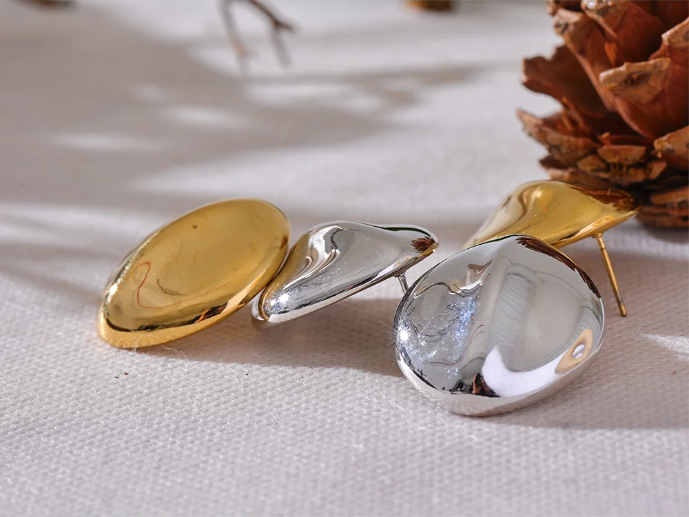 Abstract textured stainless steel stud earrings - product image