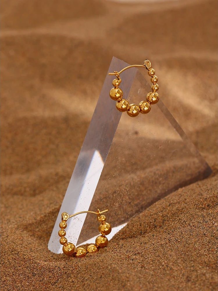 Bead round hollow simple gold color hoop earrings - product image