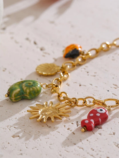 Ceramic conch fish butterfly pendant necklace - product image