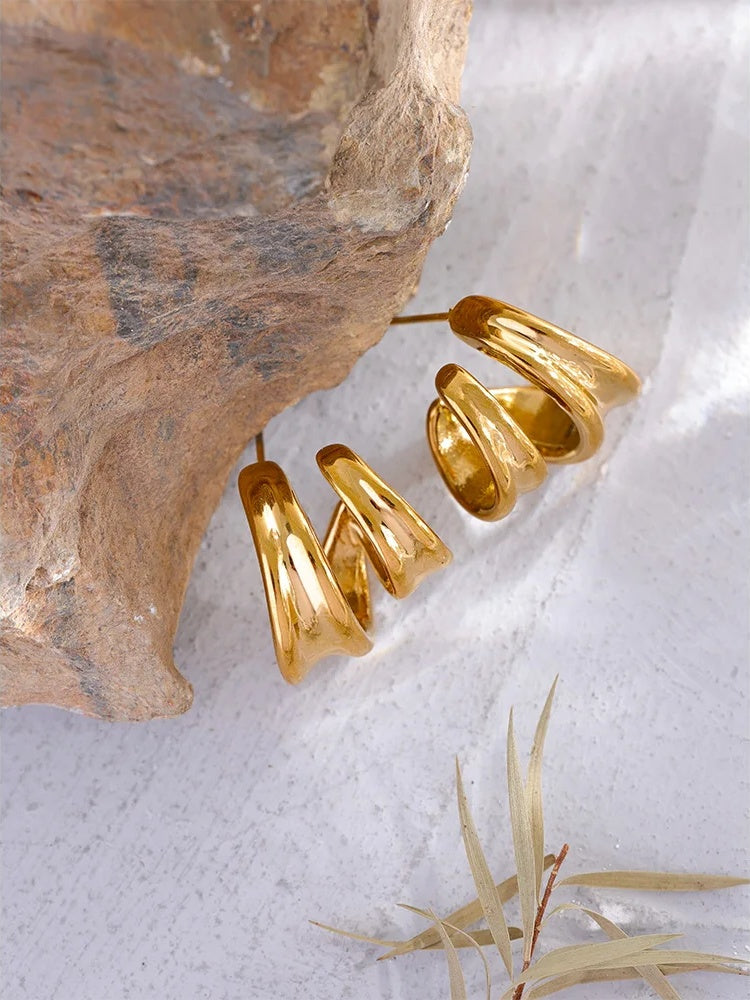 Contemporary unusual huggie metal texture earrings - product image