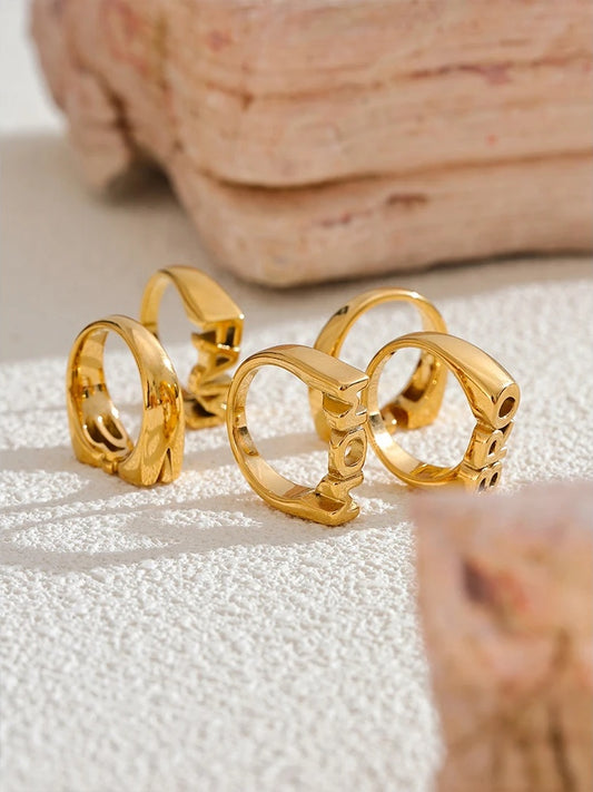 Family letter cast texture gold color statement ring - product image