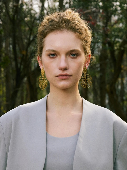 Gold color leaf hollow drop earrings women - product image