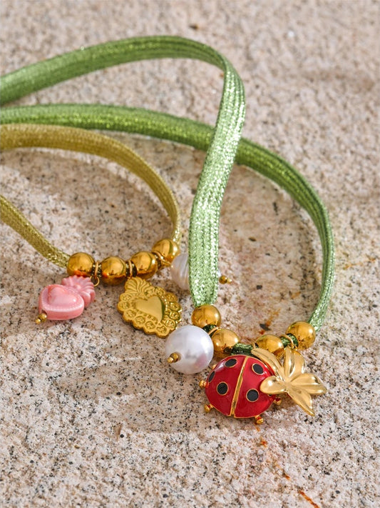 Green rope pearl ladybird heart charm - product image