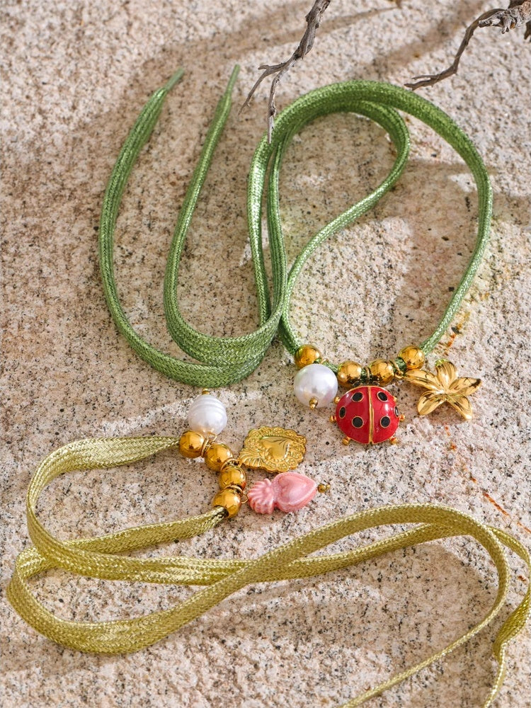 Green rope pearl ladybird heart charm - product image