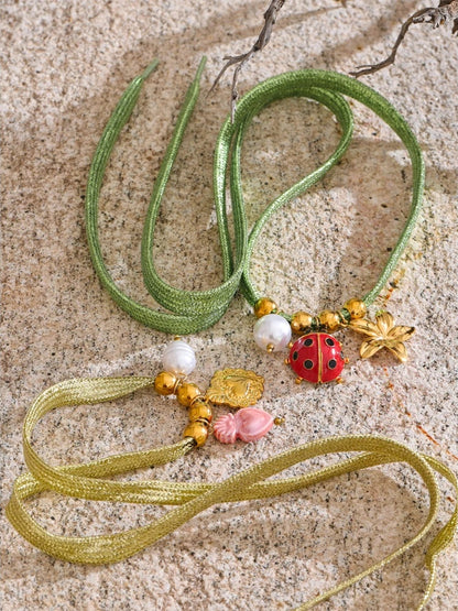 Green rope pearl ladybird heart charm - product image
