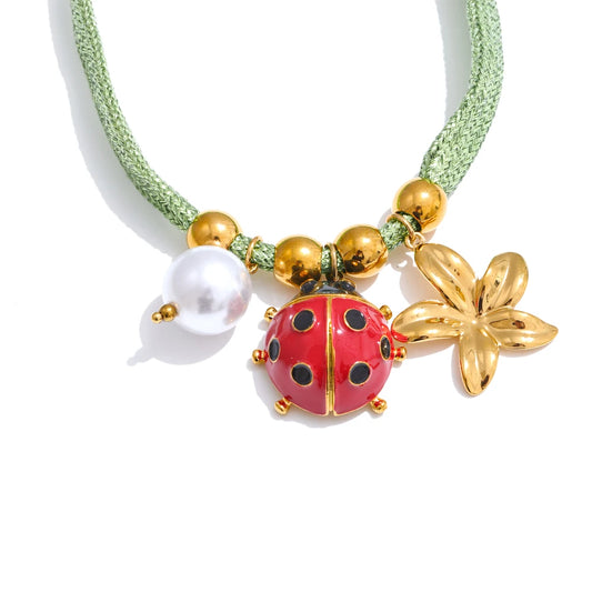 Green rope pearl ladybird heart charm - product image