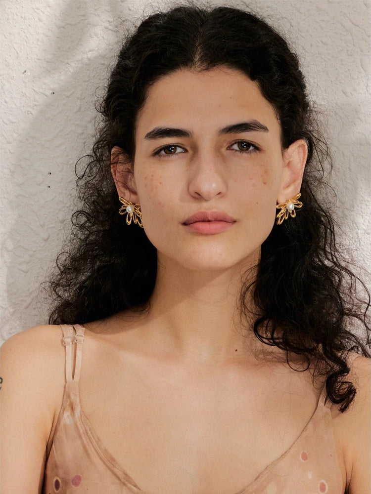 Hollow flower imitation pearls stud earrings - product image