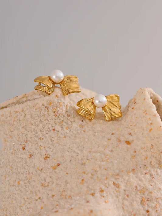 Imitation pearls bowknot stud earrings - product image