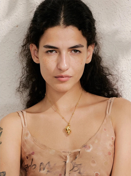 Ocean style metal conch pendant necklace - product image