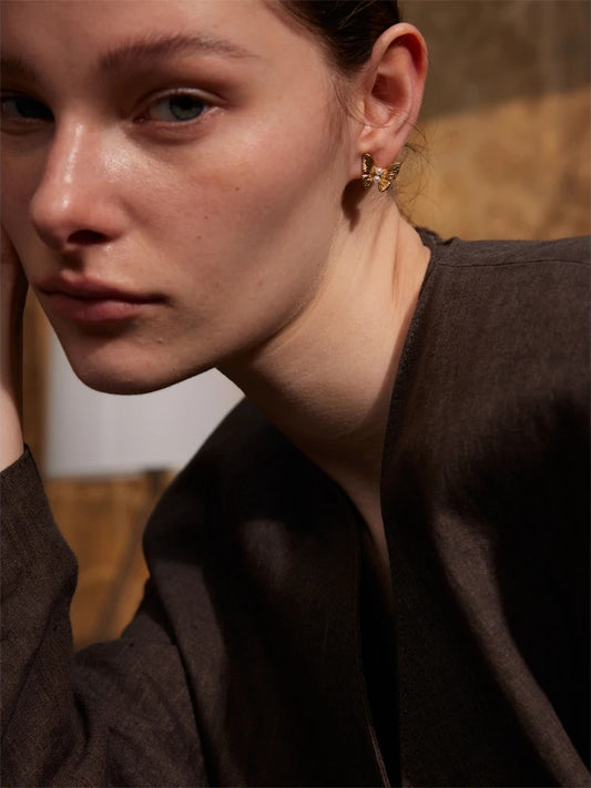 Simulated pearl butterfly push-back stud earrings - product image