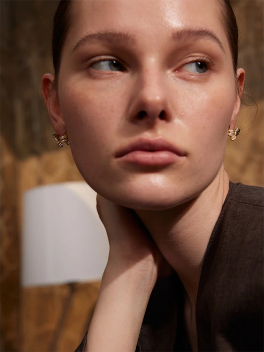 Simulated pearl butterfly push-back stud earrings - product image