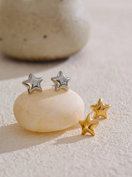 Star hollow small metal stud earrings - product image