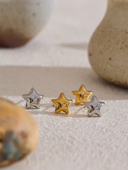 Star hollow small metal stud earrings - product image