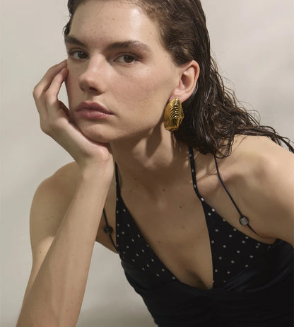 Statement gold color big stud earrings - product image