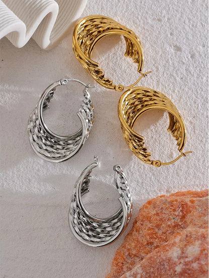 Twisted hollow hoop contemporary statement earrings - product image