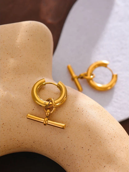 Unusual contemporary statement gold color huggie earrings - product image